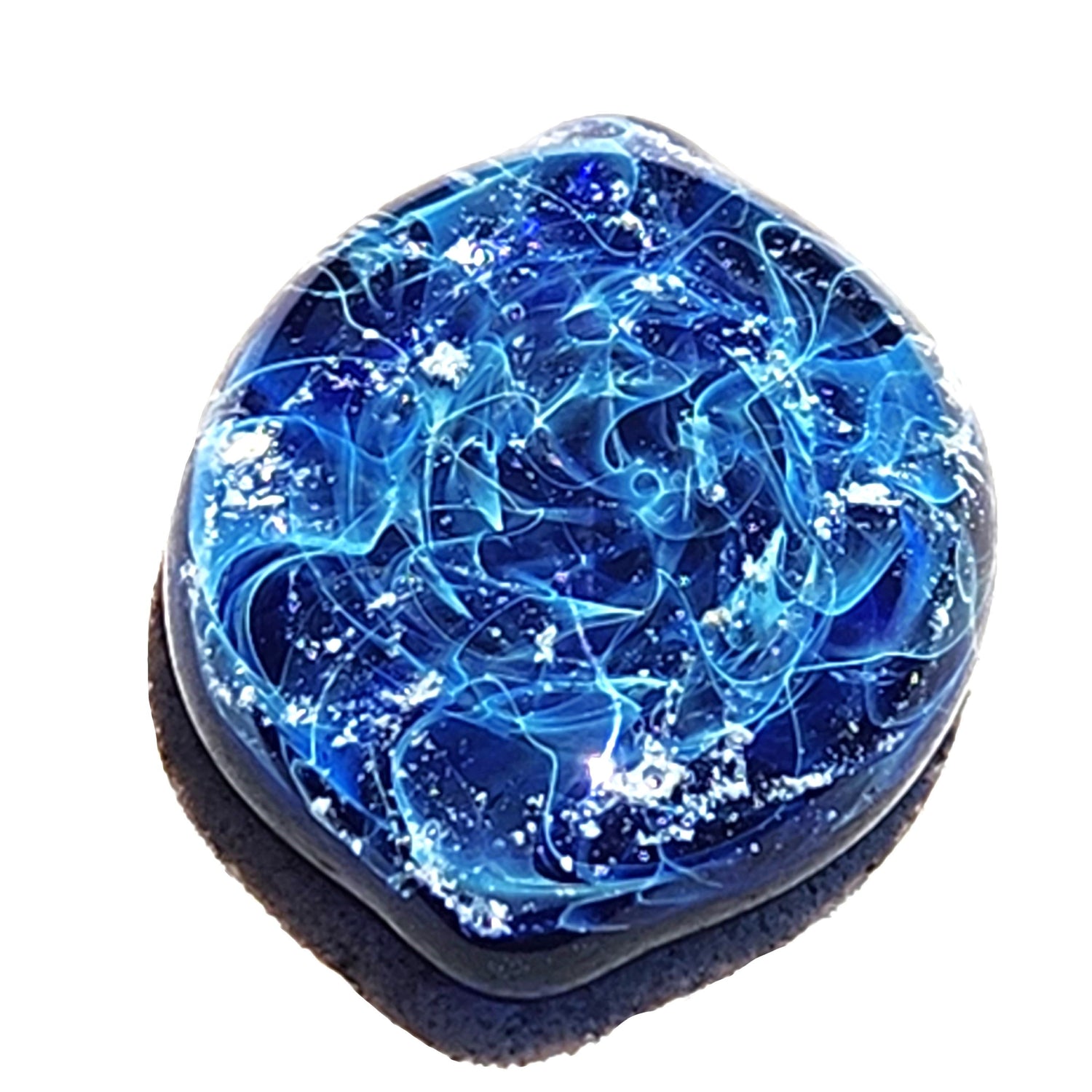 Galaxy blue oval cremation glass touchstone infused with ashes, a handmade memorial keepsake. Hand blown by DragonFire Cremation Jewelry